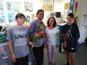 Connor Marquand, Emanual Ringia and Boston Abraham spread kindness with flowers. 